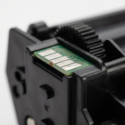 Macro detail of the contact chip and gear on an Elevate Imaging compatible HP CF226A toner cartridge.