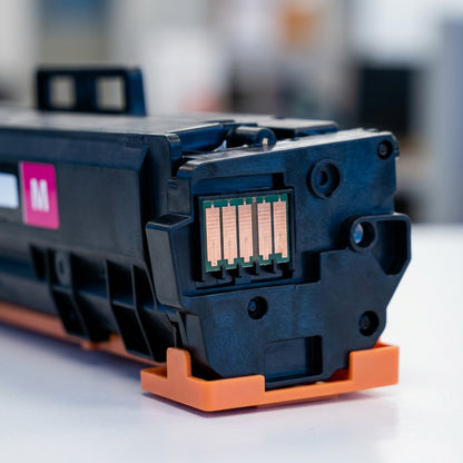 Macro detail of the copper contact chip on an Elevate Imaging HP 210A Magenta toner cartridge.