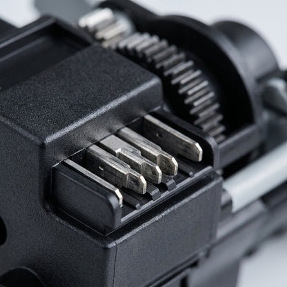 Macro view of metallic electrical contact pins and gear assembly on an HP 12A compatible toner.