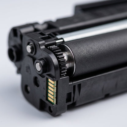 Macro detail of HP 49X 53X compatible toner cartridge showing developer roller and gold contacts.