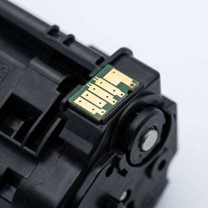 Macro view of gold-plated electrical contacts on a remanufactured HP 643A Yellow Toner Cartridge.