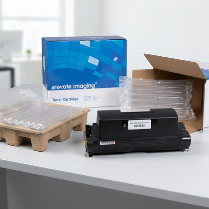 Elevate Imaging CC364X toner cartridge unboxed with protective air cushions and cardboard inserts.