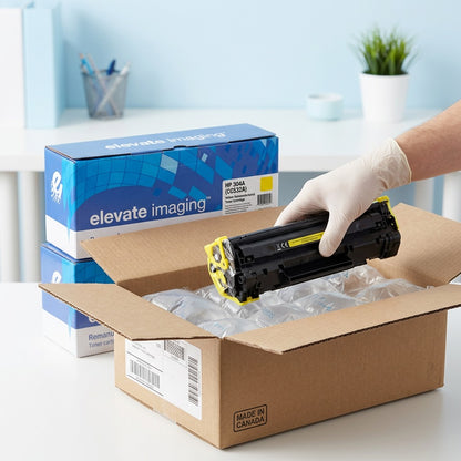 Unboxing a yellow HP 304A (CC532A) remanufactured toner cartridge from an Elevate Imaging box.