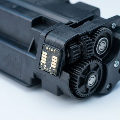 Macro view of the electronic chip and gear assembly of an Elevate Imaging HP 649X toner cartridge.