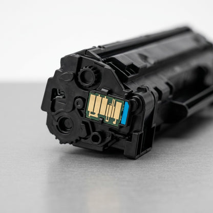 Macro detail of the electronic contact chip on a remanufactured HP 648A (CE261A) cyan toner cartridge.