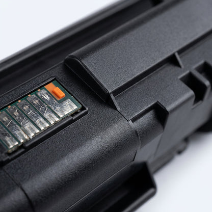 Macro detail of a remanufactured HP 651A black toner cartridge showing the smart chip and casing.