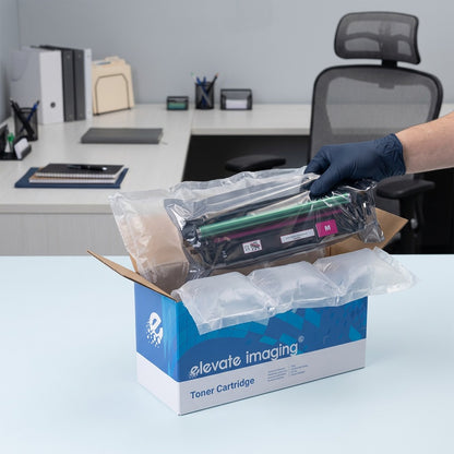 Unboxing an HP 507A Magenta toner cartridge from its Elevate Imaging box with protective packaging.