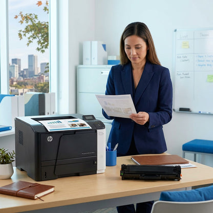 Professional inspects documents next to a laser printer and a black HP 305A toner cartridge.