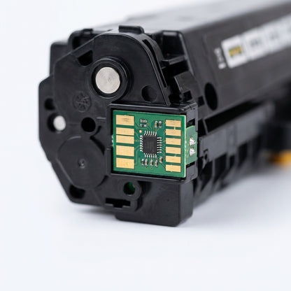 Macro detail of the gold-plated electrical contact chip on an HP 305X (CE410X) toner cartridge.