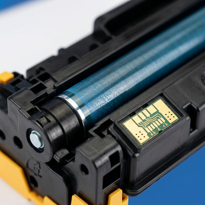 Macro detail of cyan developer roller and gold contact chip on an HP 305A (CE411A) toner cartridge.