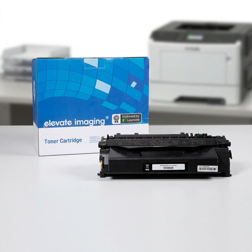 Elevate Imaging compatible HP 05X black toner cartridge with retail box in an office setting.
