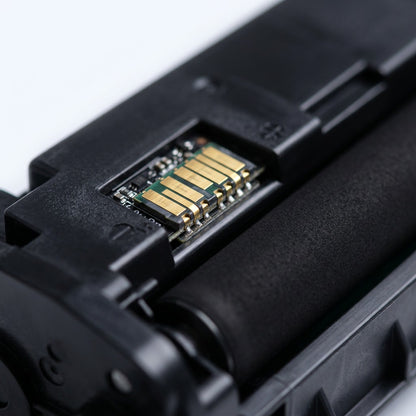 Macro detail of the gold electronic chip and developer roller on an HP 17A (CF217A) toner cartridge.