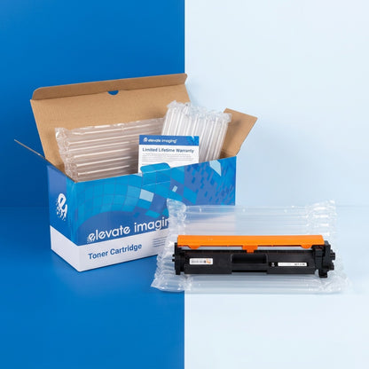 Elevate Imaging HP 17A toner cartridge unboxed with protective air cushions and warranty card.