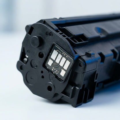 Macro detail of the electrical contact chip on an Elevate Imaging HP 26A compatible toner cartridge.