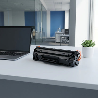 HP 87A CF287A toner cartridge on a modern desk next to a laptop and succulent for size comparison.
