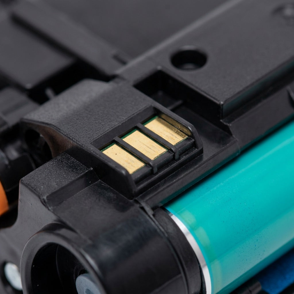 Macro detail of the gold smart chip and cyan developer roller on an HP 508A CF361A toner cartridge.