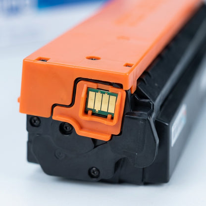 Macro detail of the gold-plated contact chip on an Elevate Imaging HP 410X cyan toner cartridge.