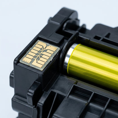 Macro detail of Elevate Imaging HP 410X yellow toner chip and bright yellow developer roller.