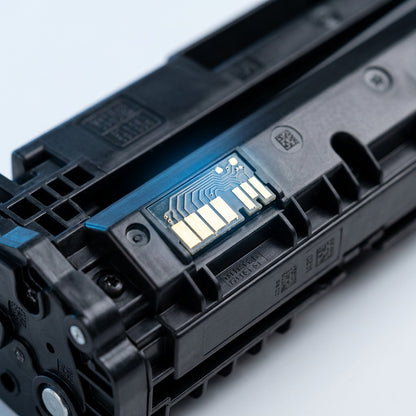 Macro detail of the gold-plated smart chip and molded housing on an HP 656X black toner cartridge.