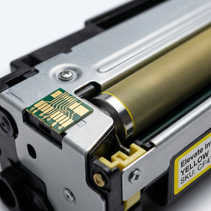 Macro detail of the gold electronic chip and textured roller on an HP 656X yellow toner cartridge.