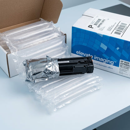 Unboxing an Elevate Imaging HP 202X toner cartridge from protective air-cushion shipping packaging.